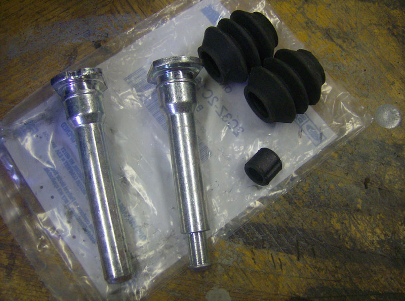 Rubber washers/bushings on front caliper slide pins? Ford Truck